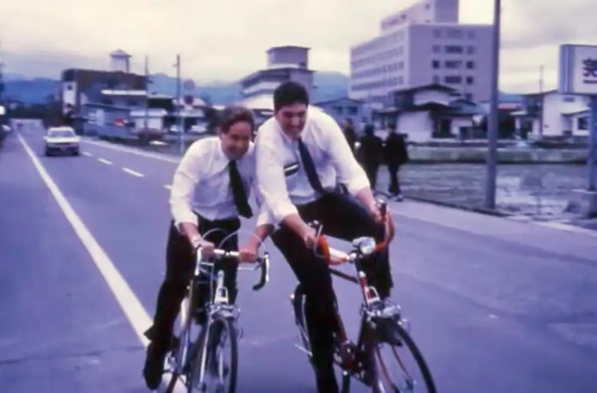 Young Mark riding a bike in Japan