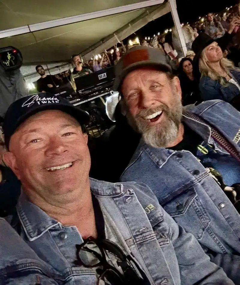 Mark and Fred smiling at an event